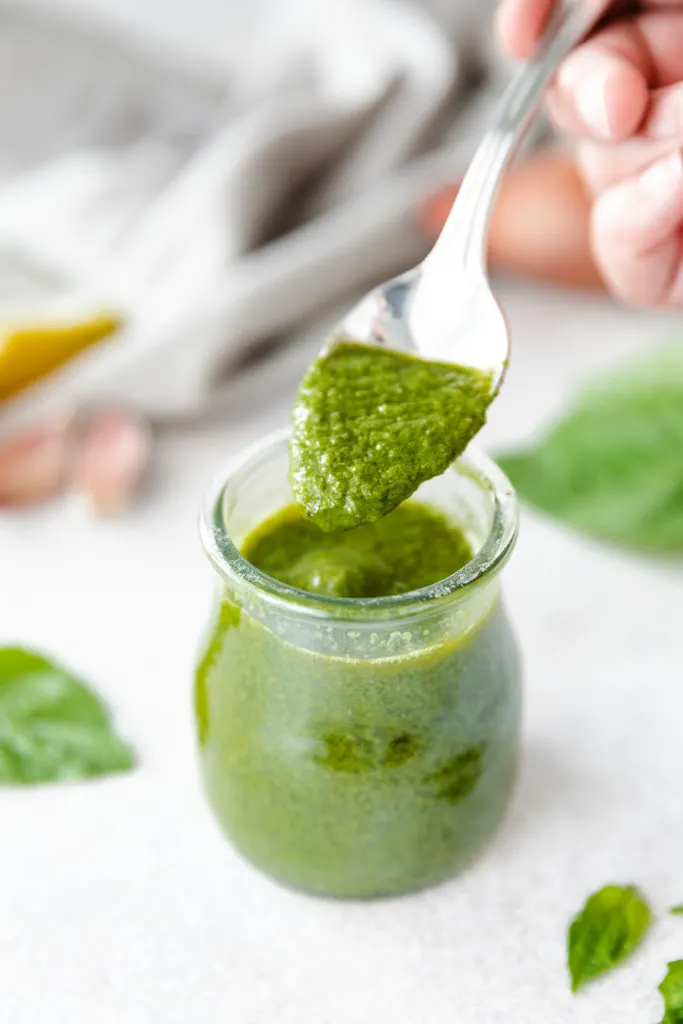 Basil vinaigrette on a spoon.