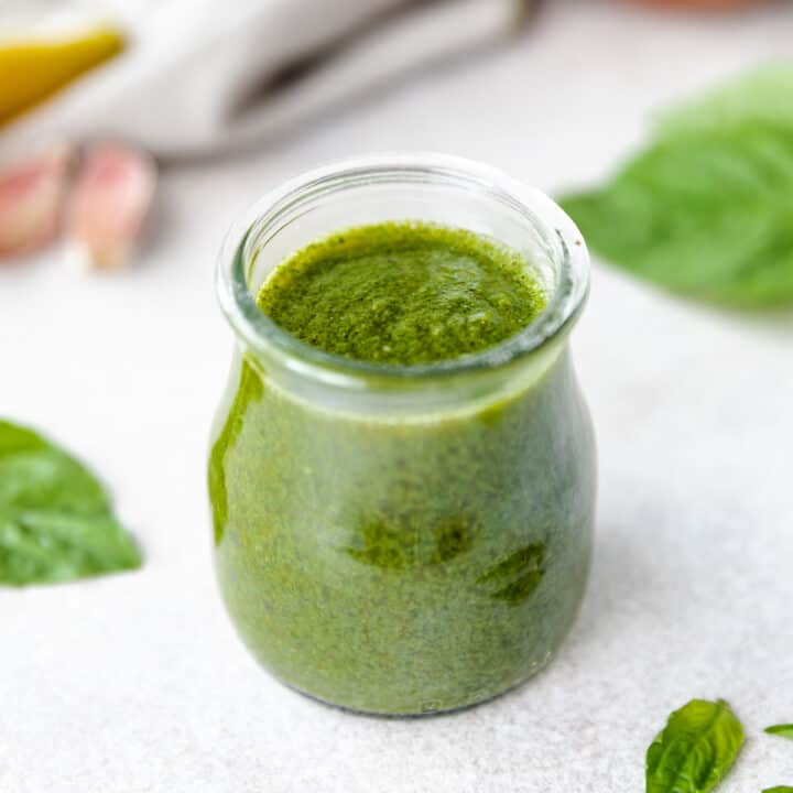 Small jar of green vinaigrette.