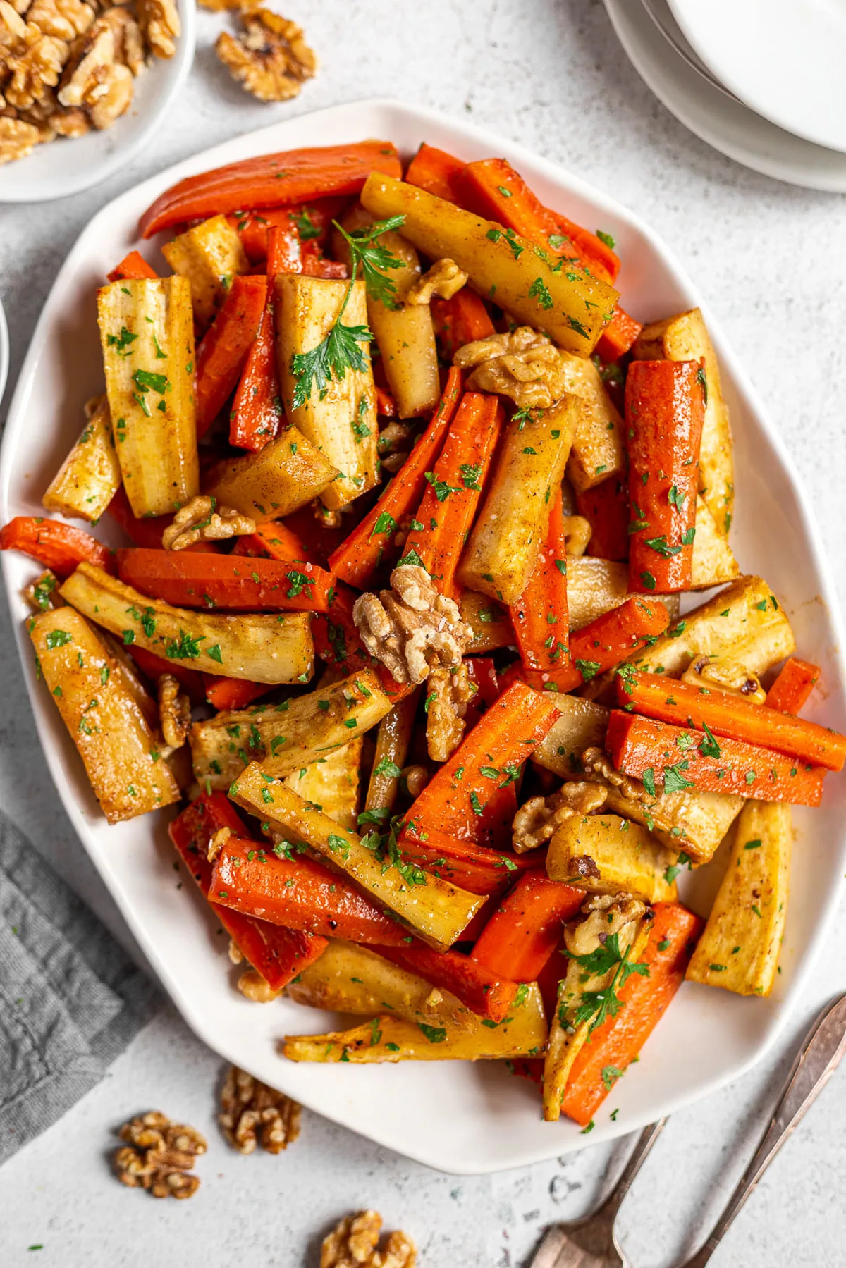 Close up view of honey roasted vegetables on a platter.