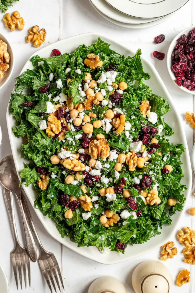 Close up view of a salad with feta, cranberries and chickpeas.