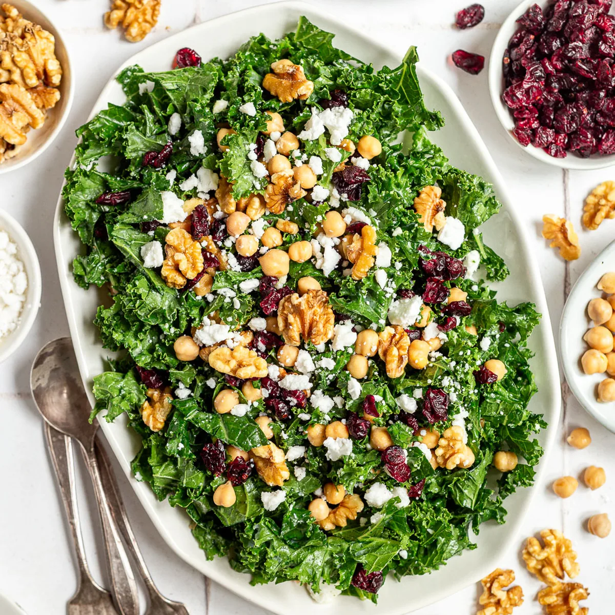 Top down view of a kale salad with toppings.