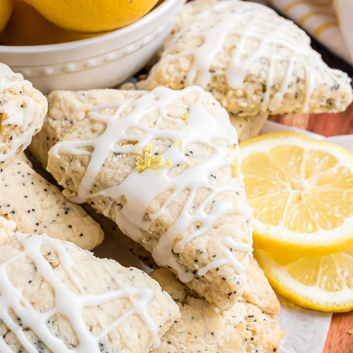 Plate of lemon scones with lemon slices.