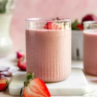 Strawberry peanut butter smoothie in a glass.