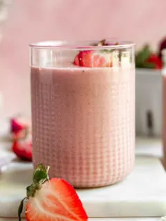 Strawberry peanut butter smoothie in a glass.