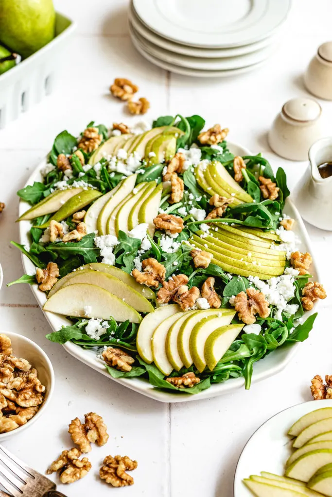 Side view of a salad platter with pear slices.