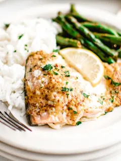 Salmon, green beans and rice on a plate.