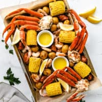 Close up view of a sheet pan low country boil.