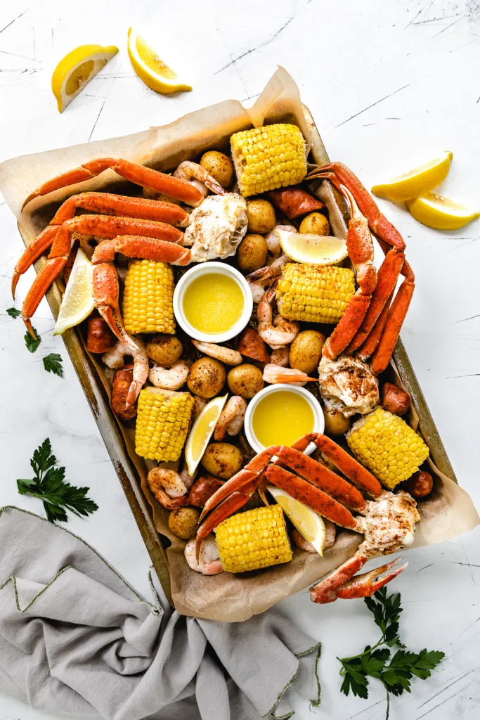 Top down view of a sheet pan low country boil.