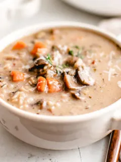 White bowl filled with mushroom soup.