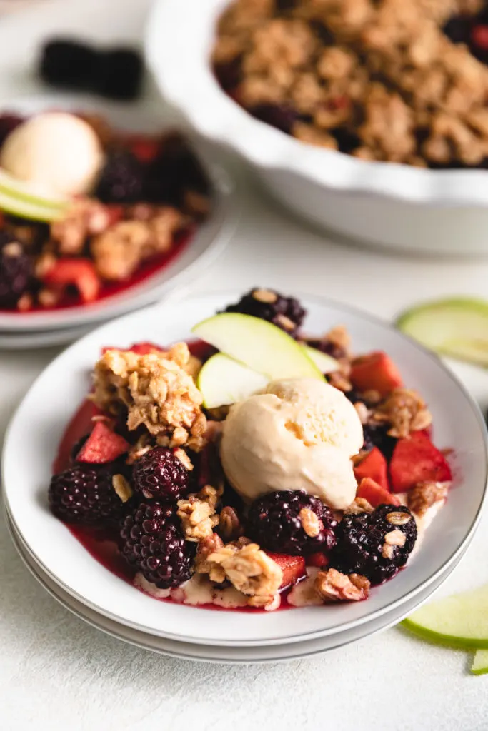 Scoop of vanilla ice cream on crumble.