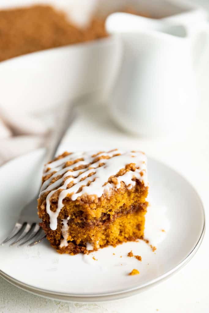 Pumpkin cake with streusel topping on a plate.
