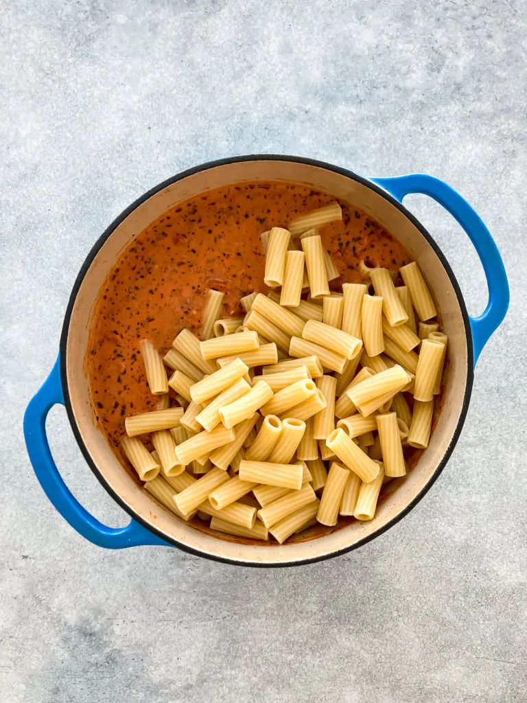 Rigatoni noodles in meat sauce.