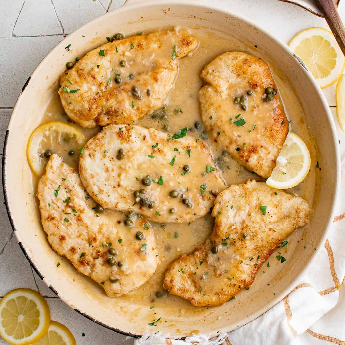 Close up view of chicken piccata in a pan.