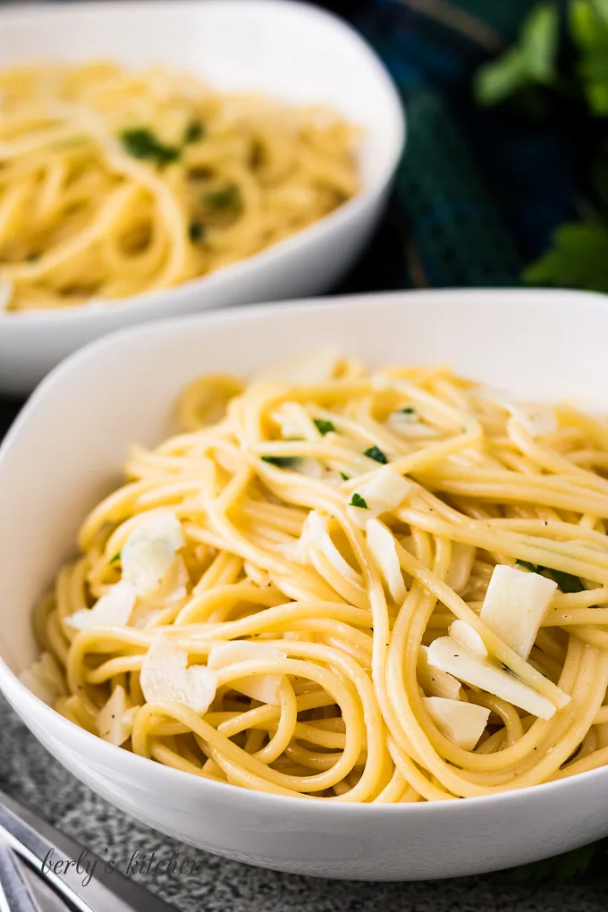 Close up view of a bowl of garlic butter pasta.