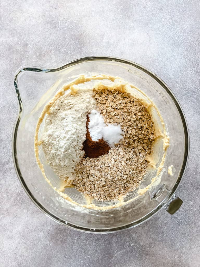 Oats, flour, and spices in a mixing bowl.