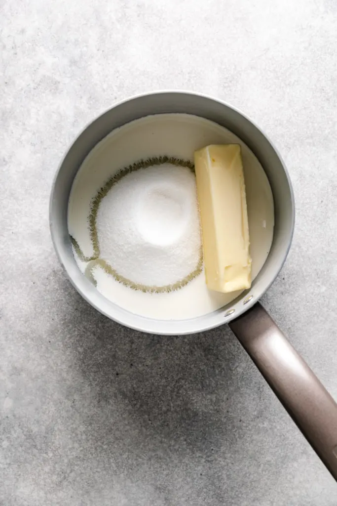 Butter, sugar, and heavy cream in a pan.