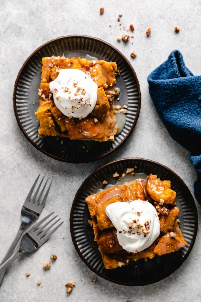 Top down view of slices of bread pudding with sauce.