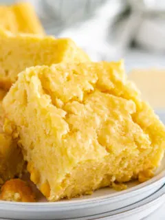 Close up view of cornbread on a plate.