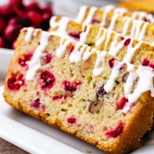 Close up view of cranberry nut bread without orange on a platter.