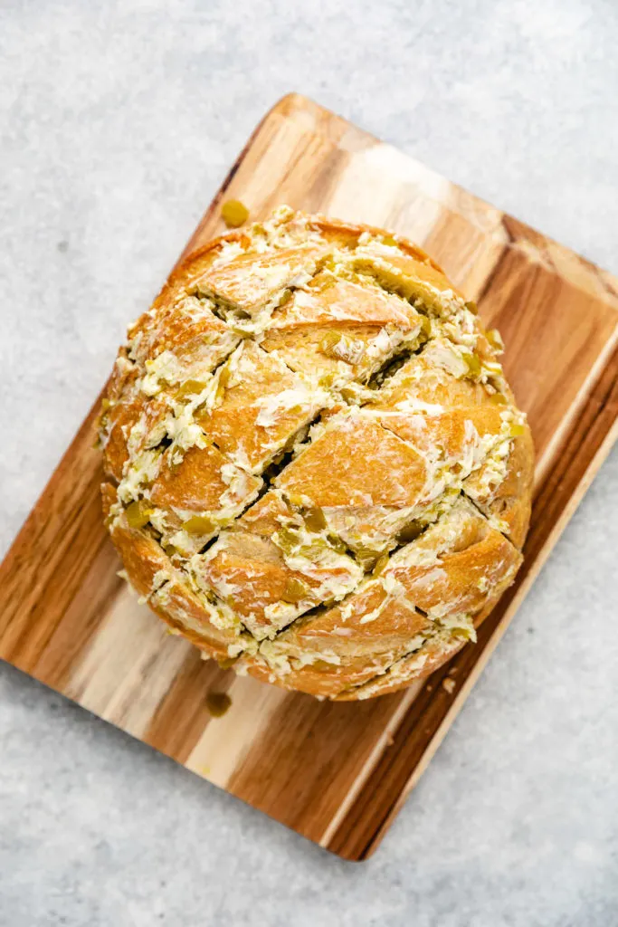 Green chile butter stuffed inside of bread.