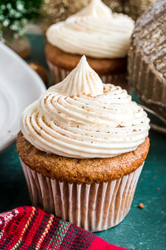 Cupcake next to a red linen.