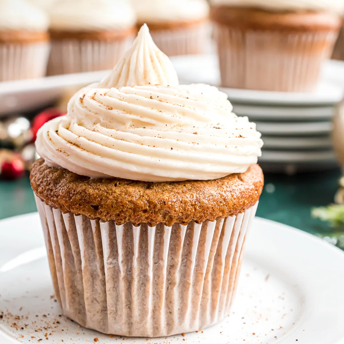 Close up view of a gingerbread cupcake on a plate.