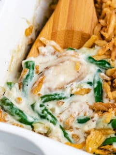 Close up view of green bean casserole in a dish.