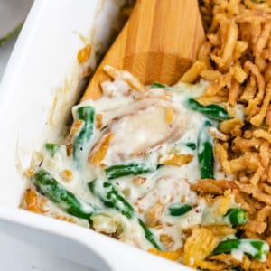 Close up view of green bean casserole in a dish.