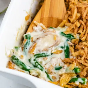 Close up view of green bean casserole in a dish.