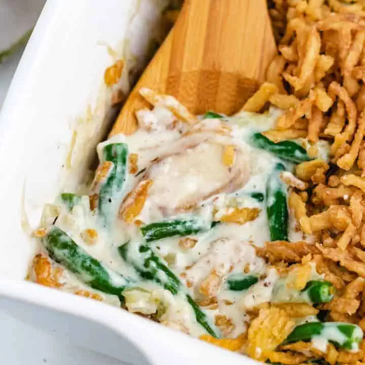 Close up view of green bean casserole in a dish.