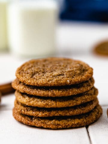 Close up view of a stack of molasses cookies.