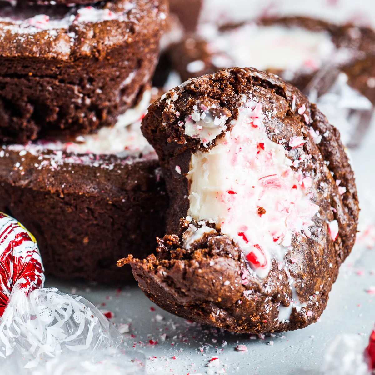 Bite taken out of a peppermint brownie muffin.