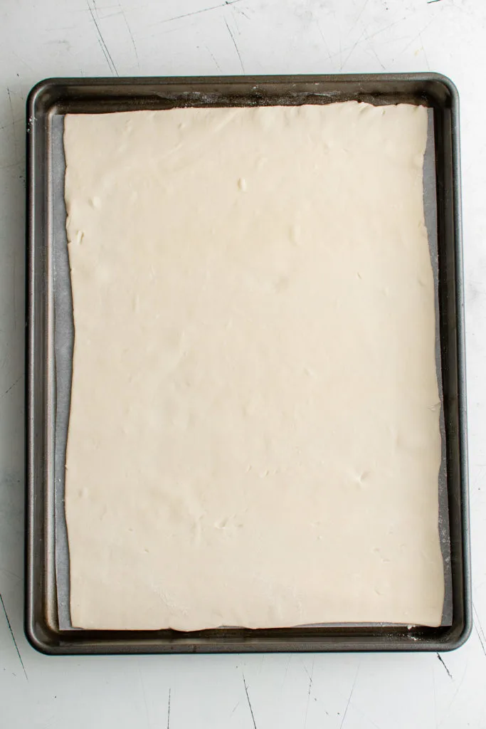 Puff pastry on parchment paper.