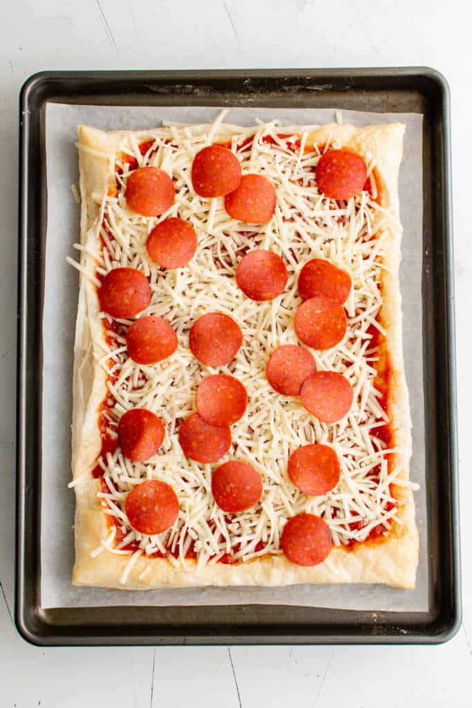 Pepperoni and cheese on puff pastry.
