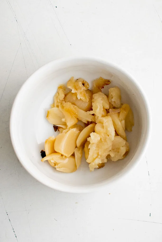 Roasted garlic in a bowl.