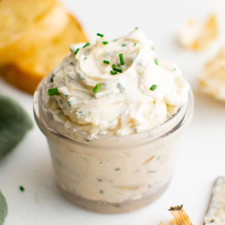 Roasted garlic butter in a small glass jar.