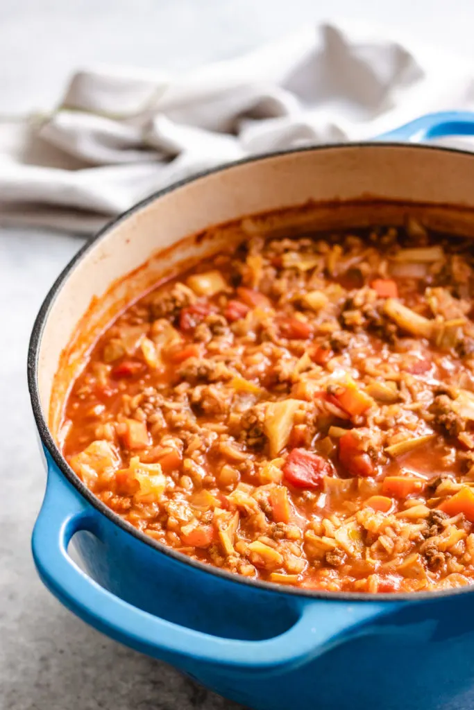 Side view of soup in a Dutch oven.