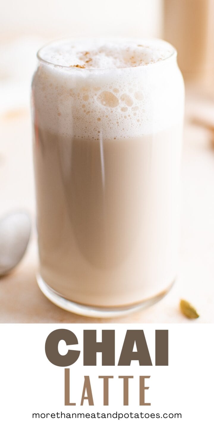 Beer can glass filled with iced chai latte.