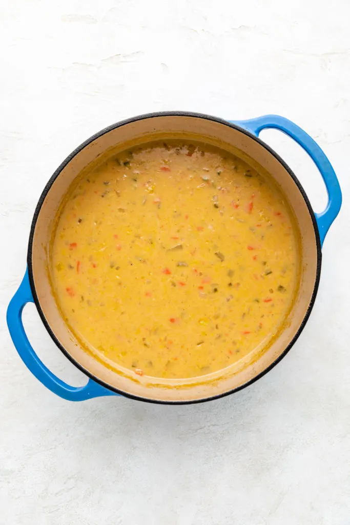 Dutch oven filled with corn chowder.