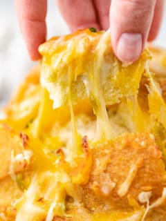 Close up view of a piece of cheesy pull apart bread.