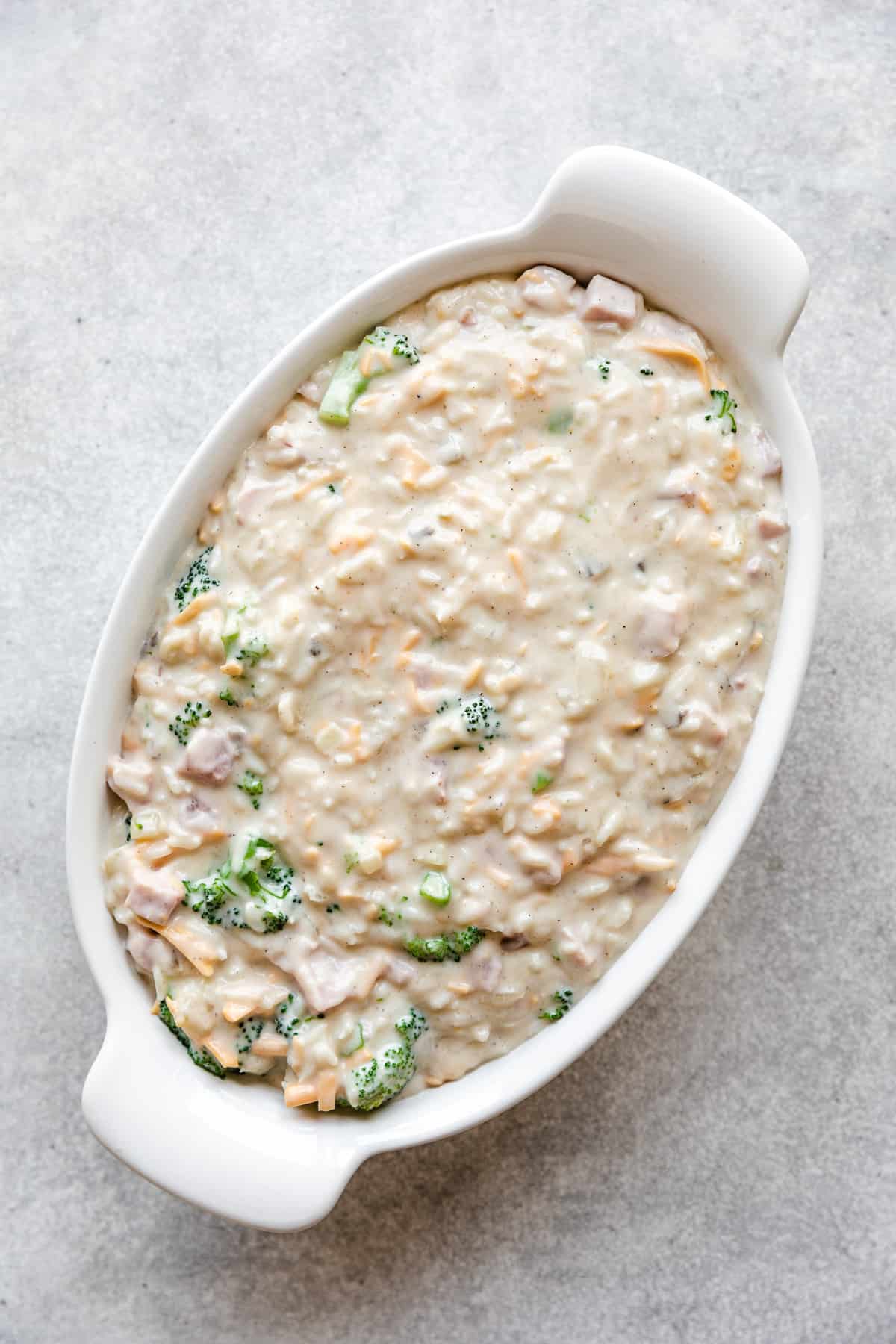 Casserole filling scooped into a dish.