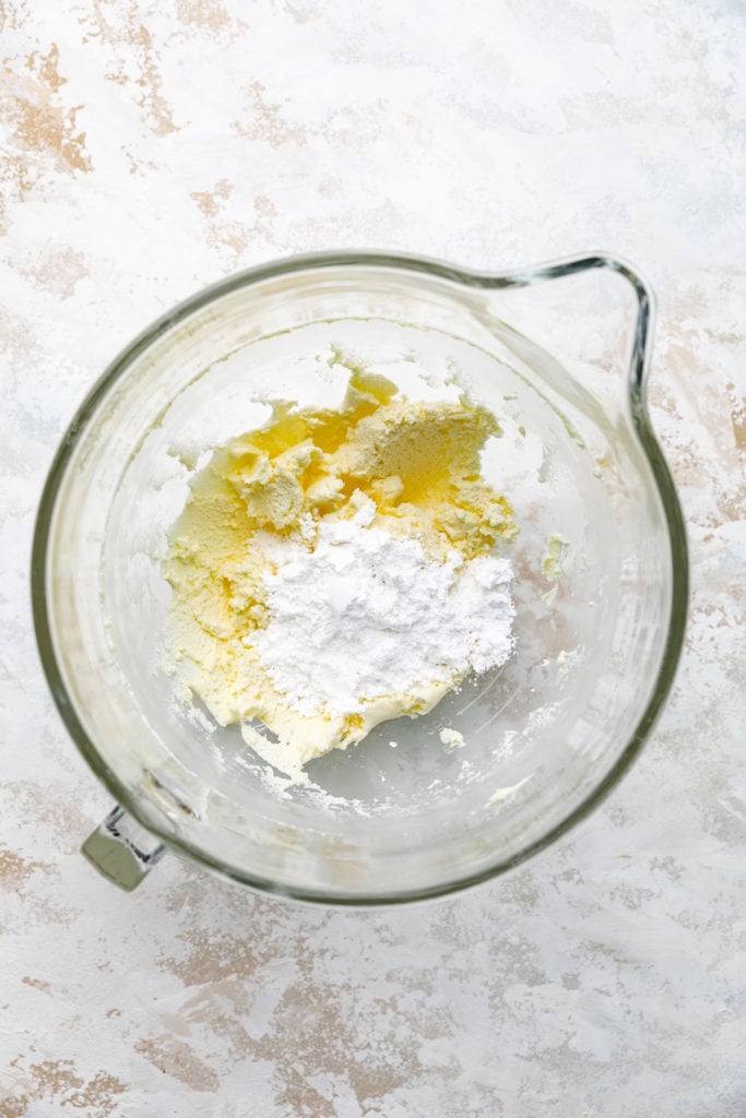 Powdered sugar and mascarpone in a bowl.