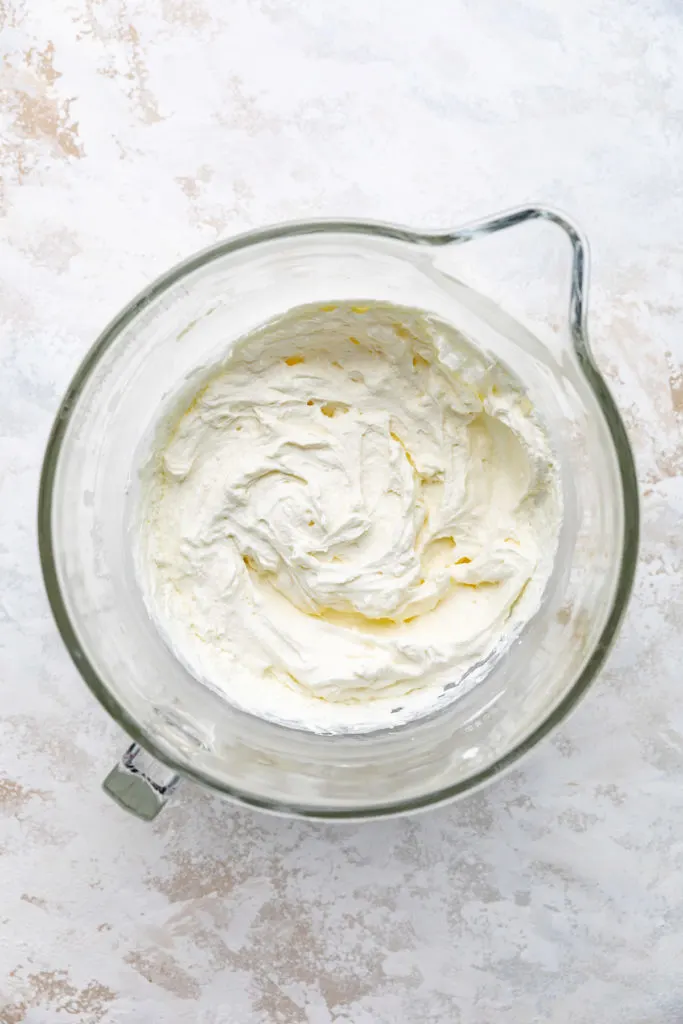 Whipped cream in a mixing bowl.