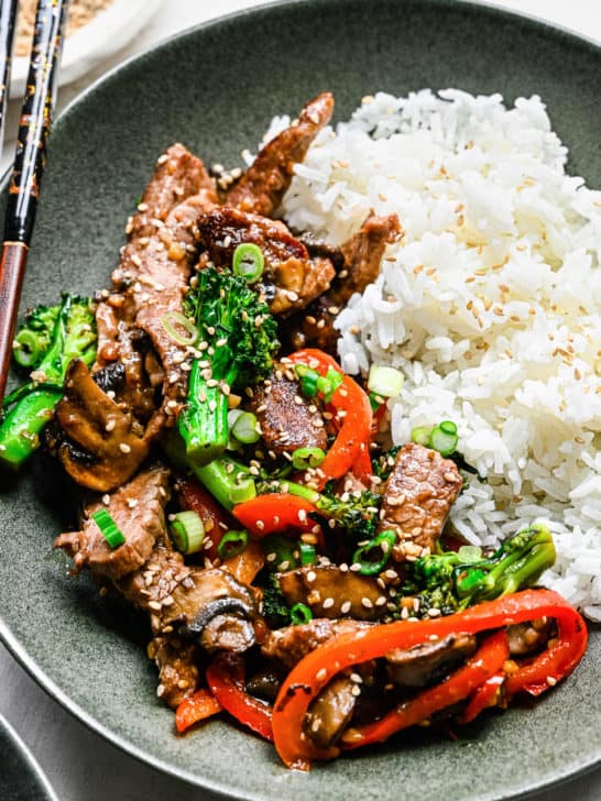 Close up view of beef cooked in a garlic sauce.
