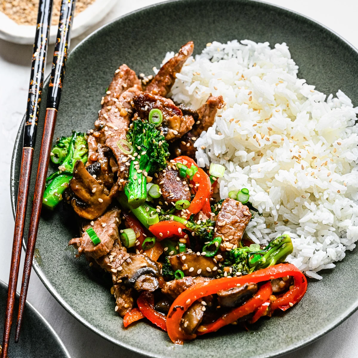 Close up view of beef cooked in a garlic sauce.