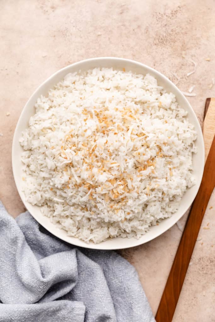 Top down view of a large dish filled with coconut flavored rice.