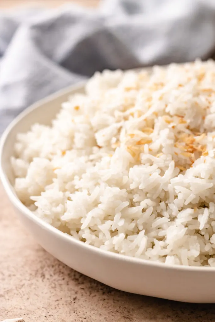 Side view of coconut rice in a bowl.