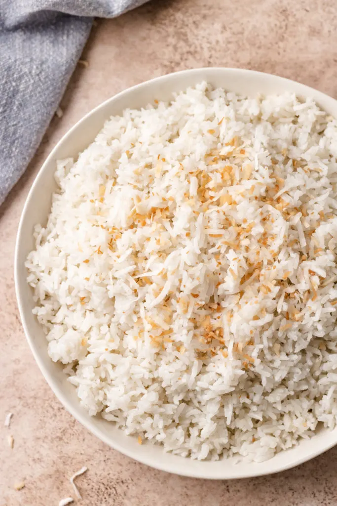 Top down view of a serving dish filled with coconut jasmine rice.