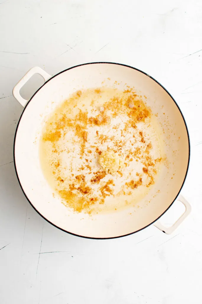 Garlic cooking in a pan.