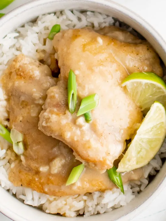 Close up view of a bowl of coconut lime chicken.